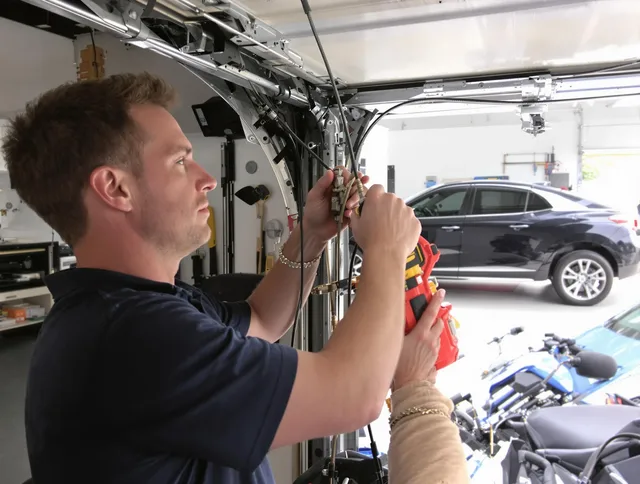Garden Grove Garage Door Repair safety certified technician performing cable replacement in Garden Grove