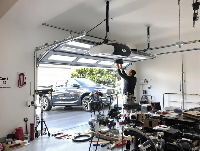 Garden Grove Garage Door Repair specialist installing smart garage door opener system in Garden Grove home